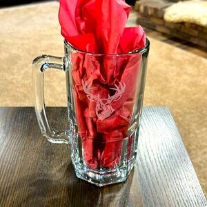 Glass beer mug with deer etching.